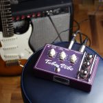 Tube-Vibe Guitar pedal on a stool with guitar and amp in background
